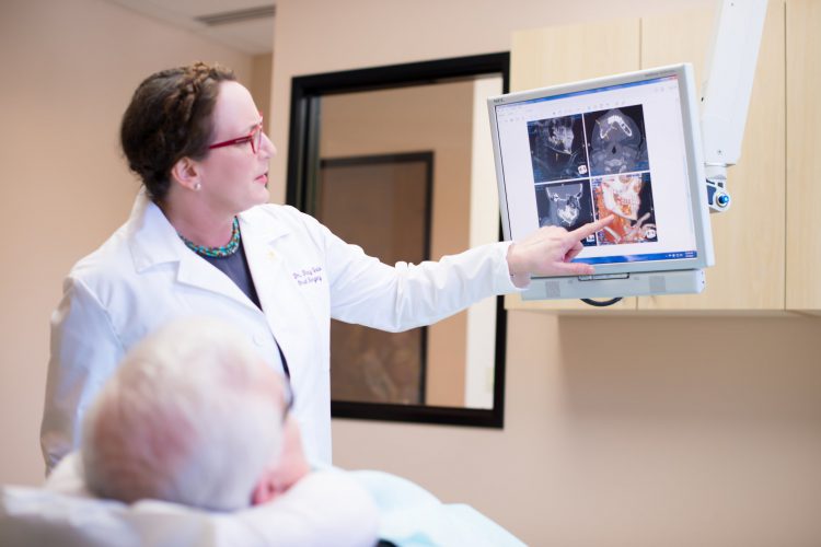 Dr. Geisler showing a patient xrays