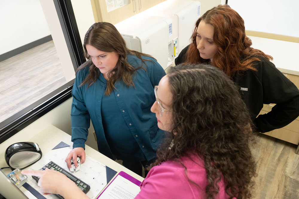 Dr. Geisler and staff reviewing surgical information