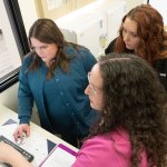 Dr. Geisler and staff reviewing surgical information