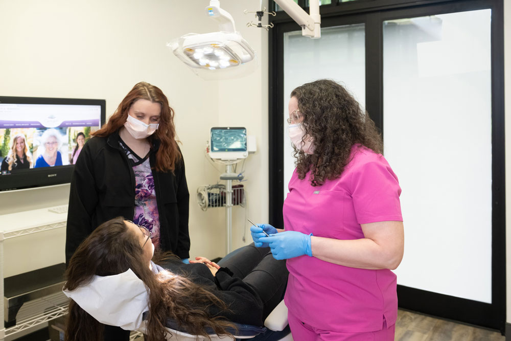 Dr. Geisler and staff reviewing surgical information with a patient