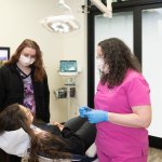 Dr. Geisler and staff reviewing surgical information with a patient